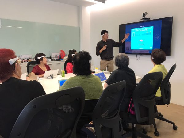 NeeuroFIT participants learning to play MindCopter, an attention training brain game
