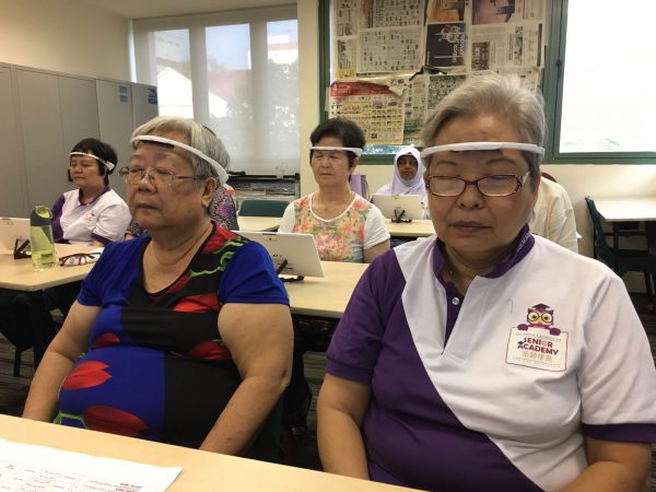 Seniors relaxing by closing their eyes