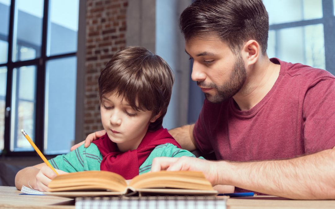 Father assisting his child in studying