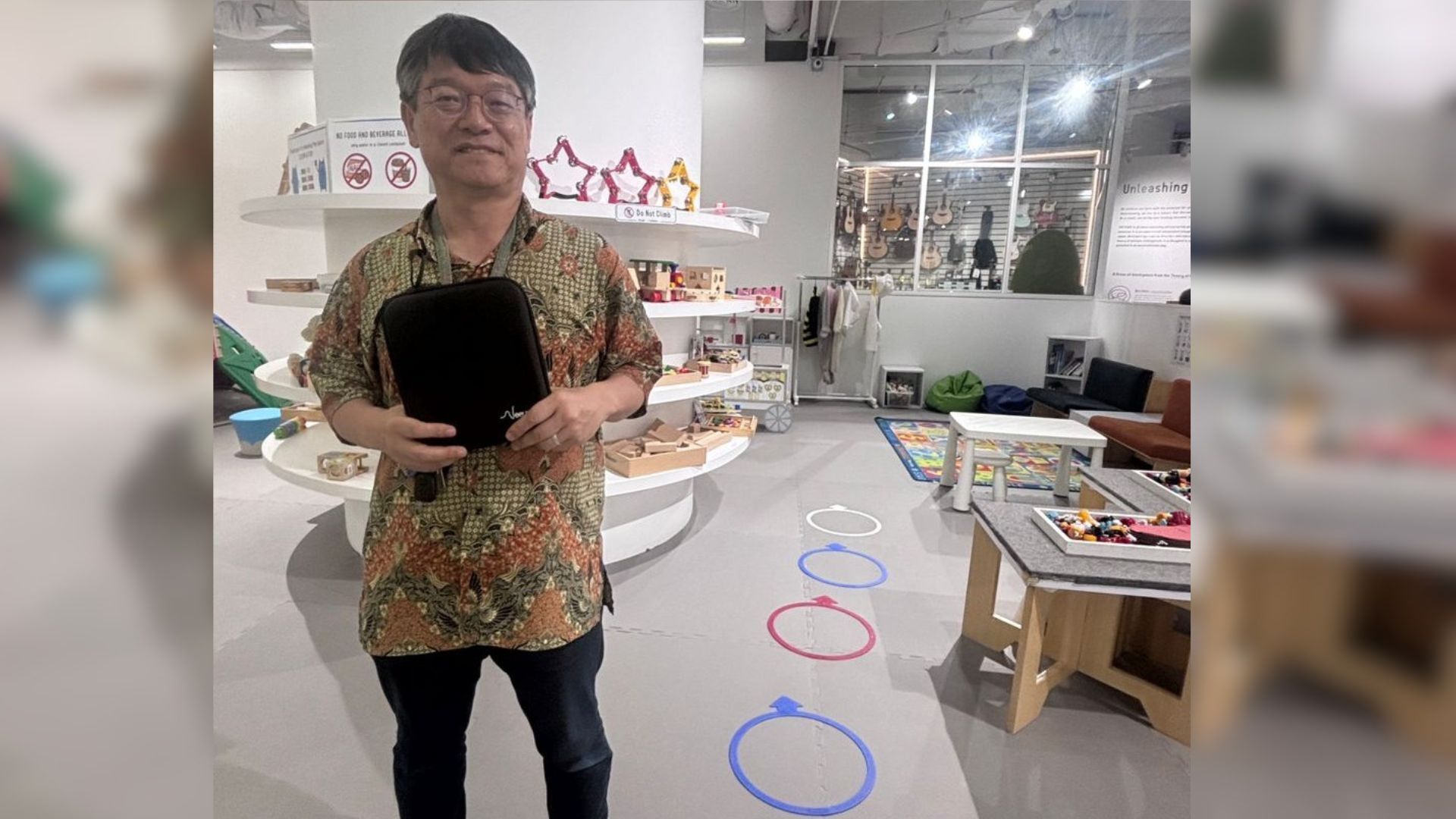 Mr.Miyoshi holding the SenseBand 2