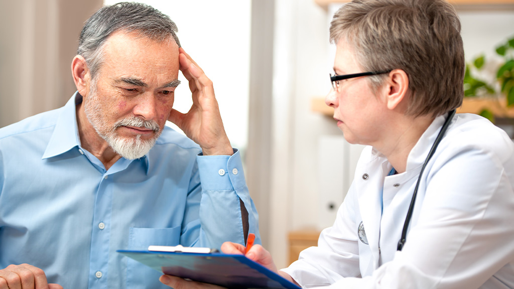 Doctor consulting a senior patient