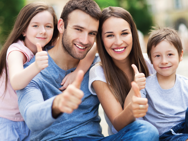 family giving a thumbs up